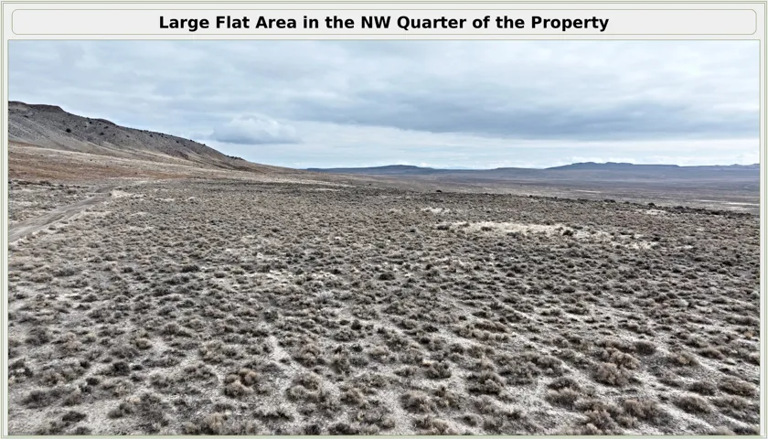 Large flat acreage in the northwest quarter of the property featuring expansive open land with native desert vegetation and natural terrain