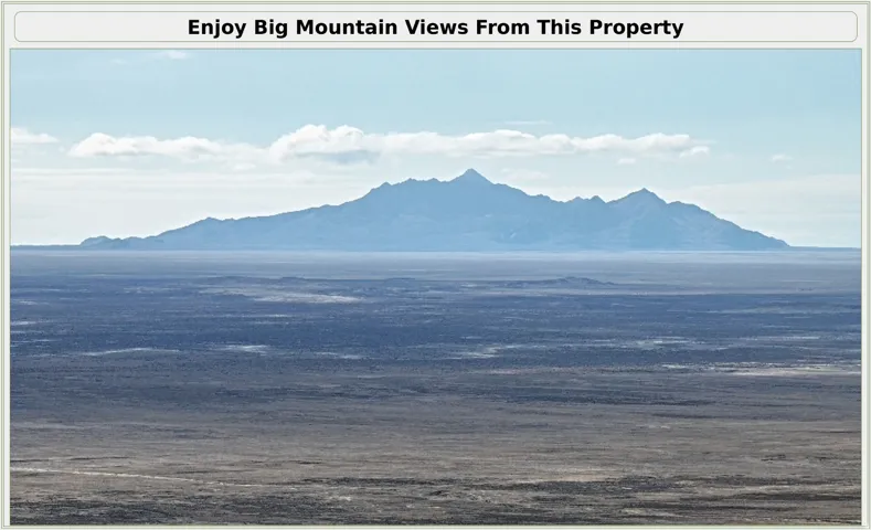 Expansive vista showcasing dramatic mountain scenery across the landscape