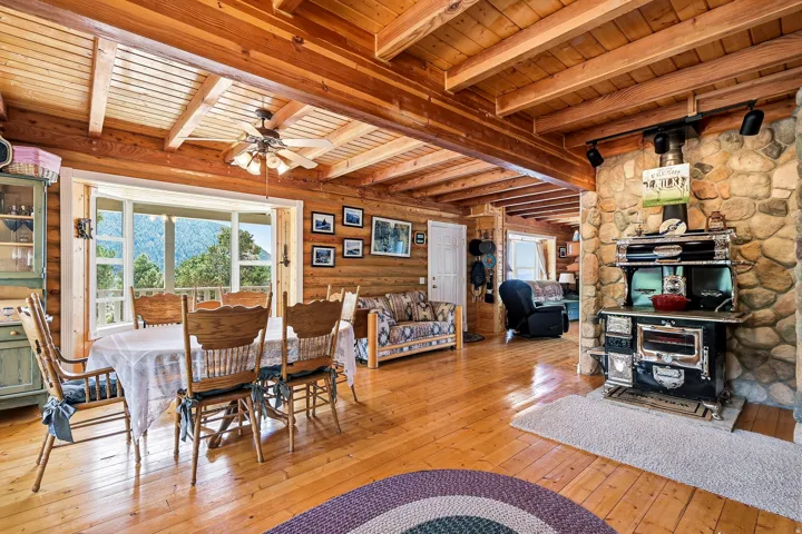 Wood-finish flooring with exposed wood beam ceiling