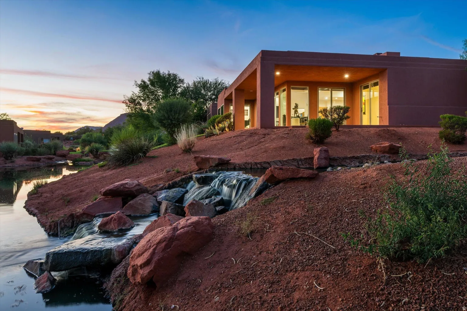 Contemporary architecture featuring a flat roofline and stucco exterior