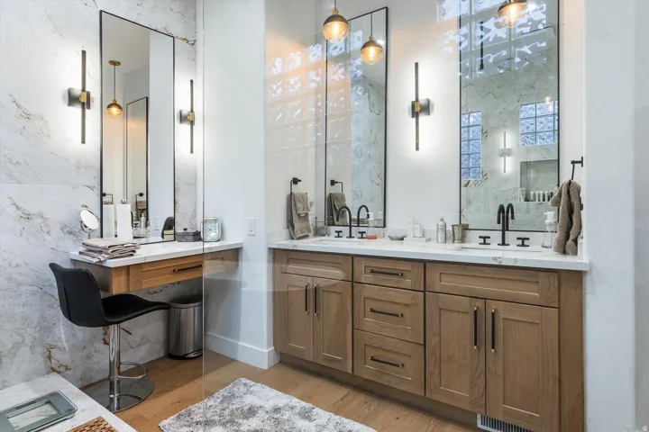 Dual wood-finish vanities with light countertops