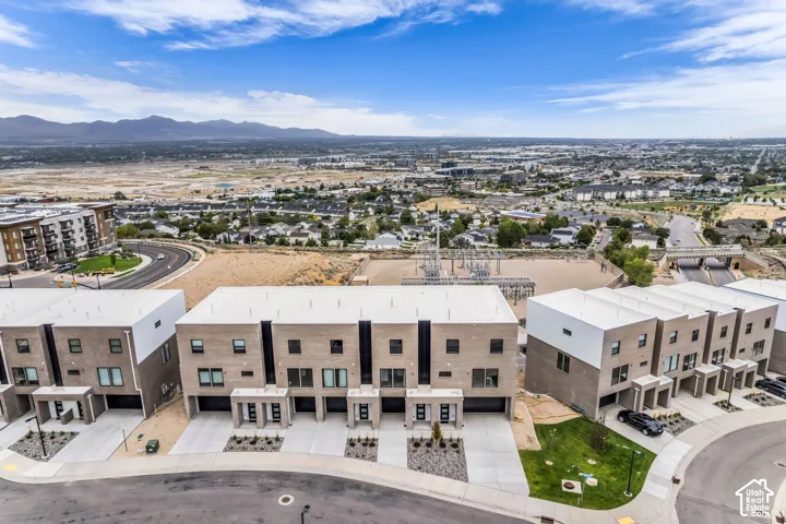 Modern multi-story structures featuring brick exteriors and flat roofs