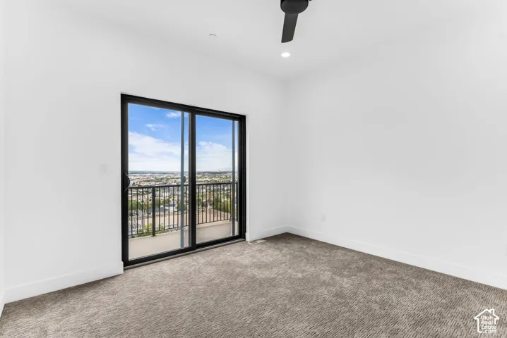 Primary Bedroom w/ balcony offering valley views.