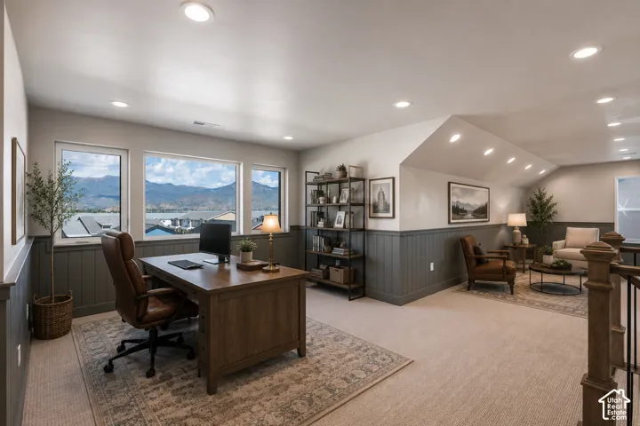 Expansive room featuring multiple windows, recessed lighting, and a neutral color palette