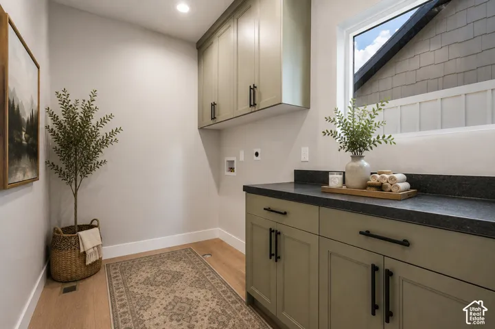 Built-in cabinetry, recessed lighting, wood-finish flooring, ample counter space, and a large window