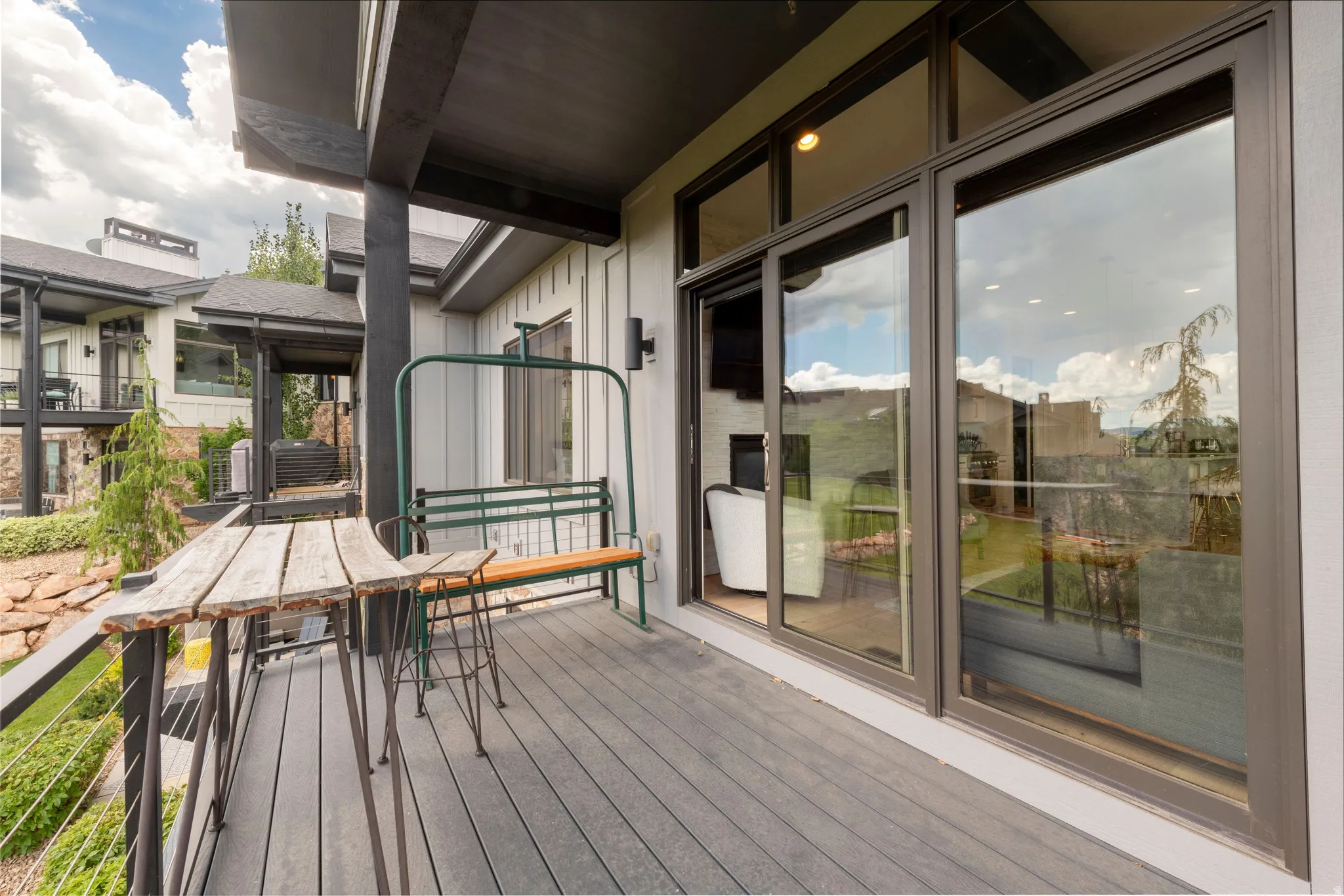 Spacious outdoor balcony featuring composite decking and sleek cable railings
