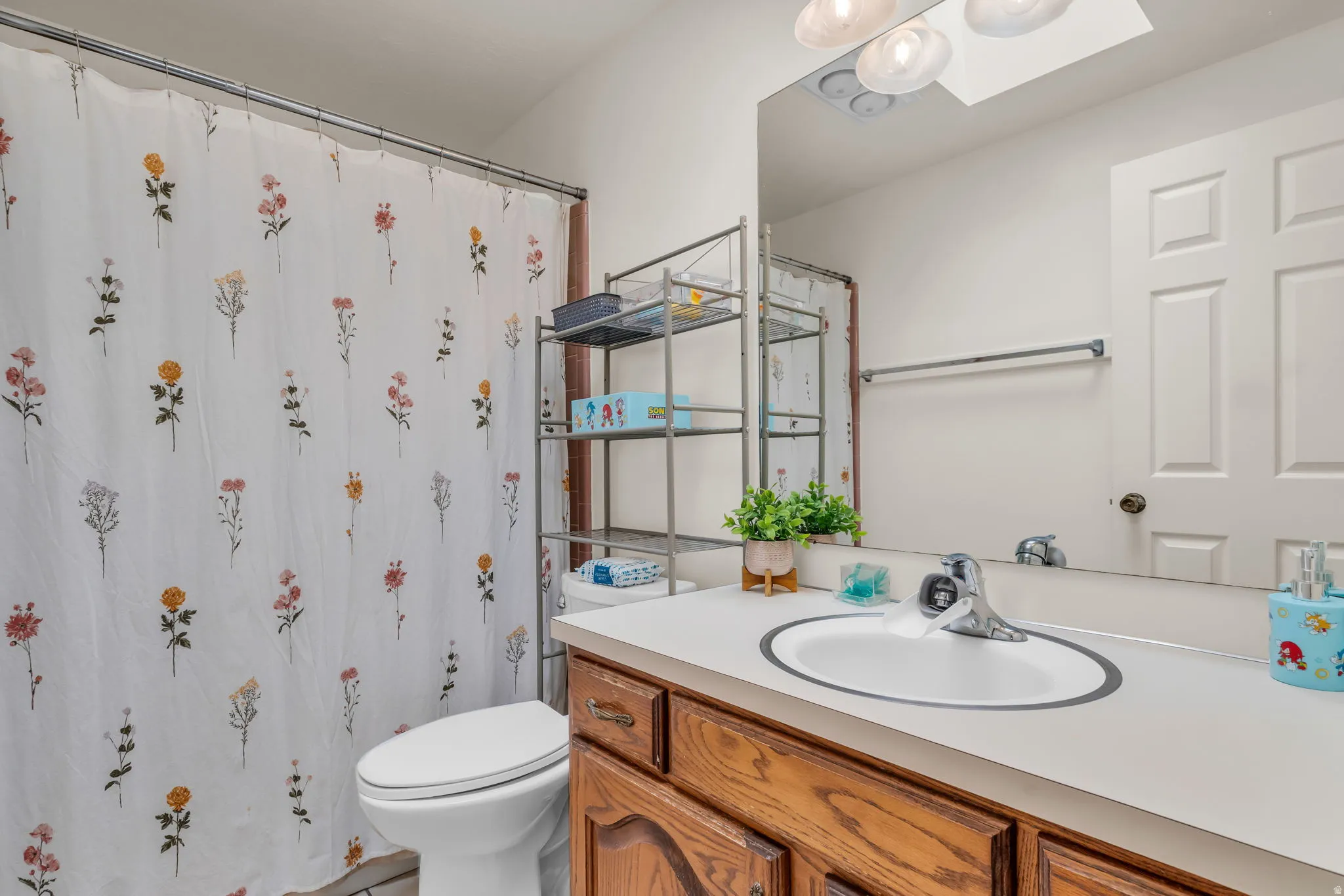 White vanity countertop with an integrated sink and chrome faucet