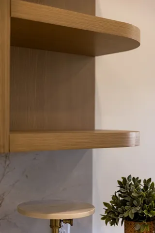 Modern floating shelving with warm wood-finish construction and rounded edge detailing