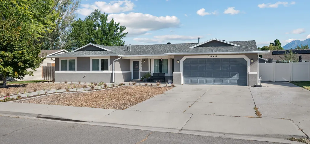 Contemporary ranch-style exterior with gray stucco siding
