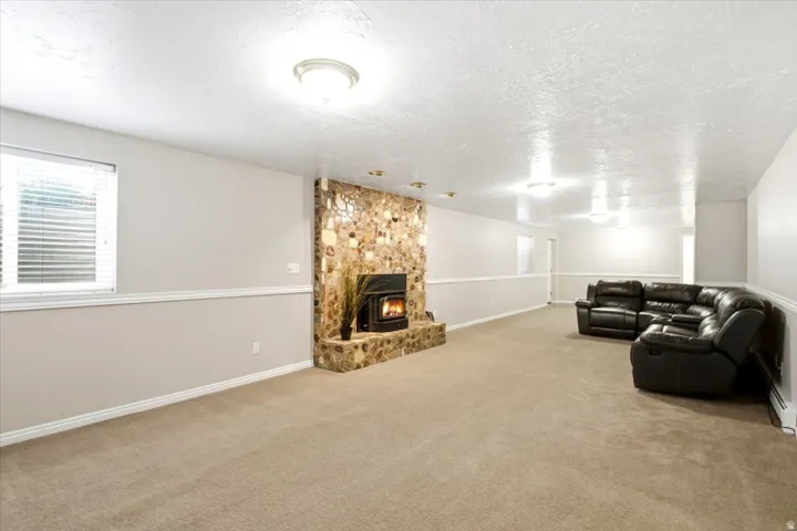 The spacious basement family room features a wood-burning stove with an available gas line for future conversion.
