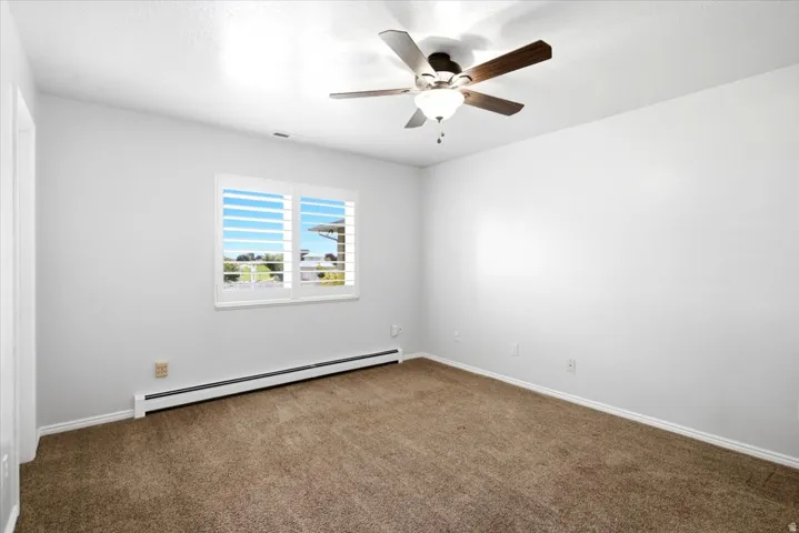 The second additional main level bedroom offers flexibility for household members, guests, or a home office.