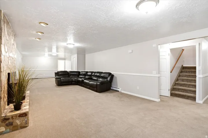 Another view of the expansive basement family room, offering plenty of flexible living space.