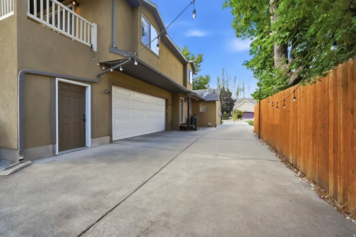 Concrete driveway leading to an attached two-car garage