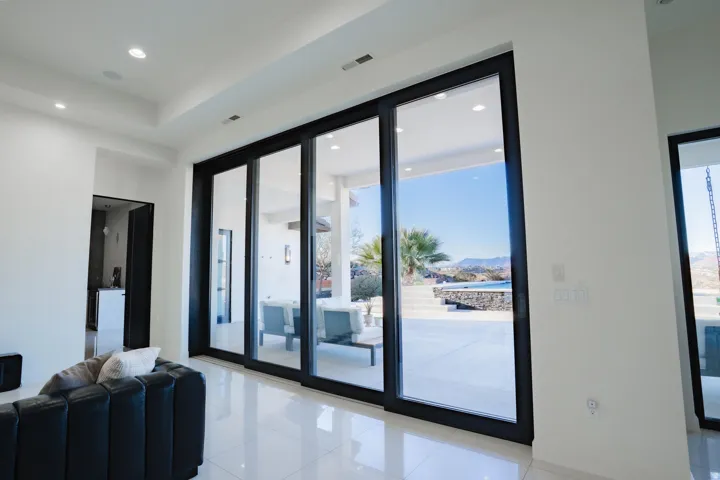 Expansive sliding glass doors with black frames