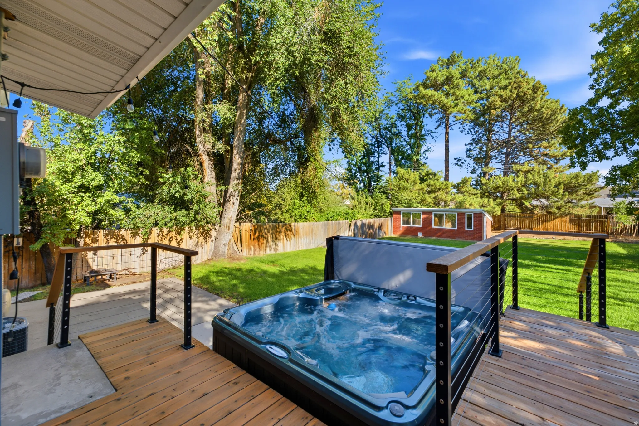 Outdoor wood-finish deck with built-in hot tub