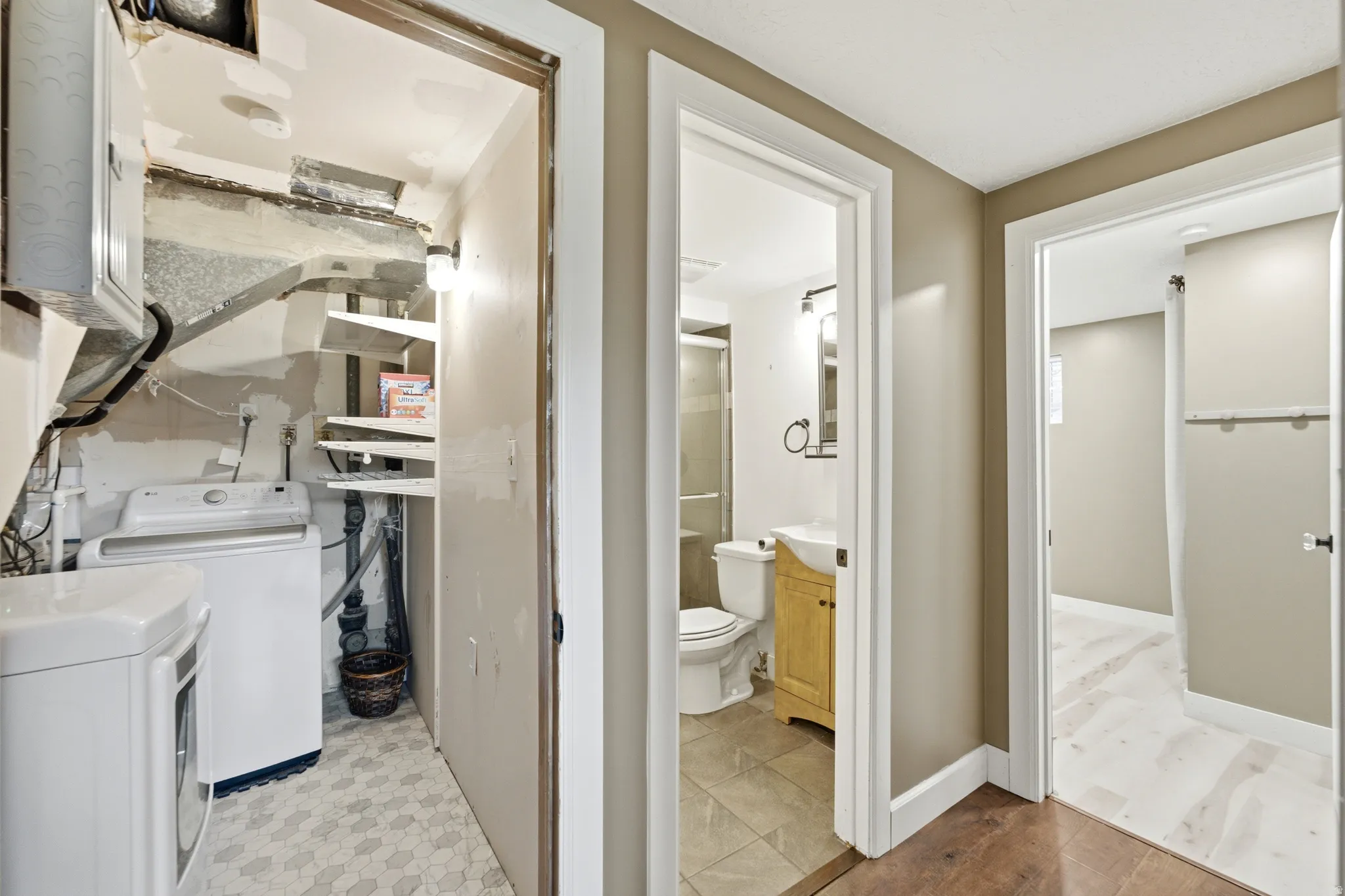 Laundry area with hexagon tile flooring