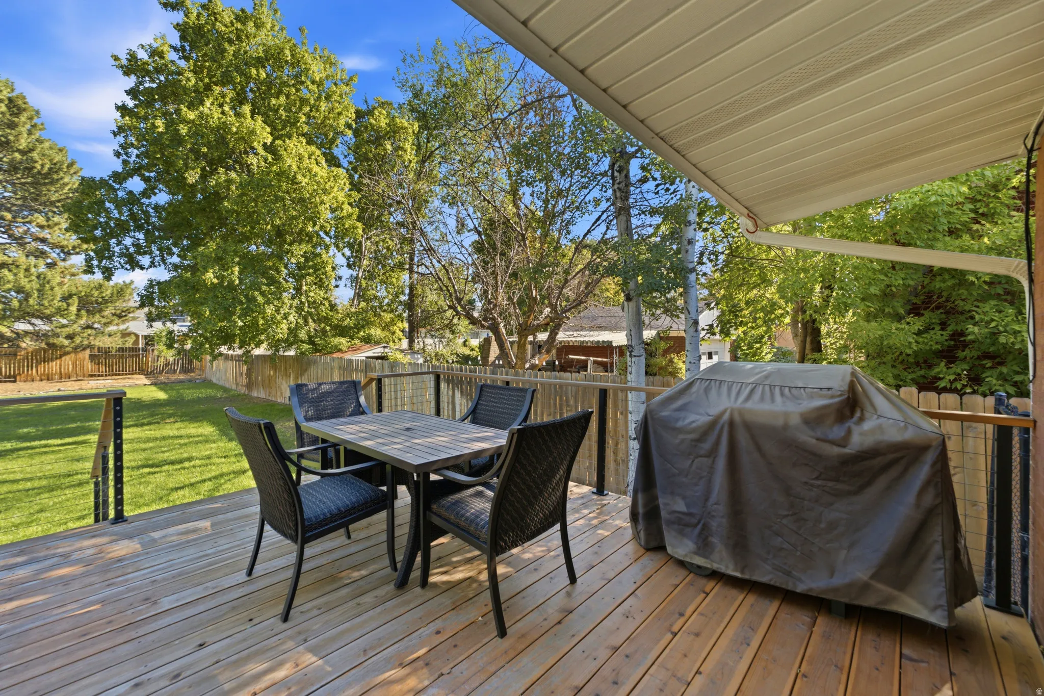 Expansive wooden deck with a protective overhang