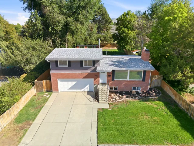 Brick and siding exterior with a shingle roof
