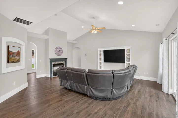 Vaulted ceilings, wood-finish flooring, built-in entertainment cente