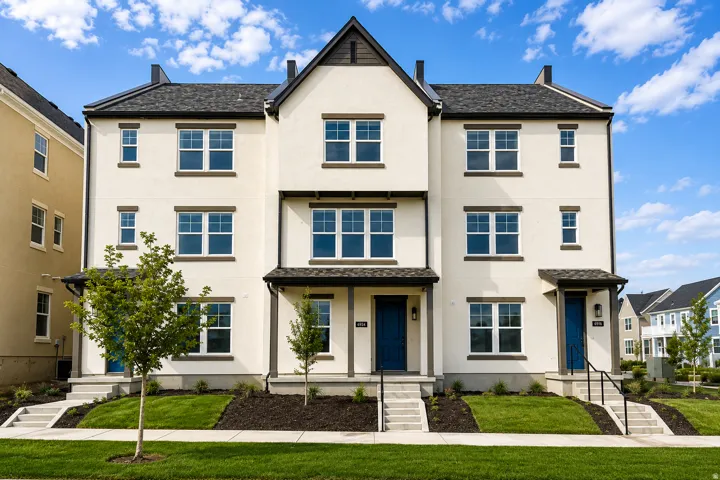 Contemporary stucco exterior with dark trim accents