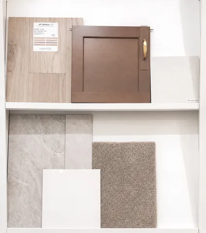 Samples of the flooring, cabinets, and countertops selected for this home.