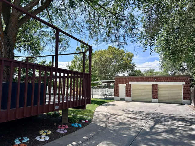 Oversized garage (approximately 30x30) with large storage area in the back and drain in the floor to make it convenient to wash your vehicle