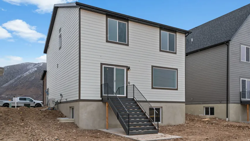 Two-story exterior with horizontal siding and dark trim