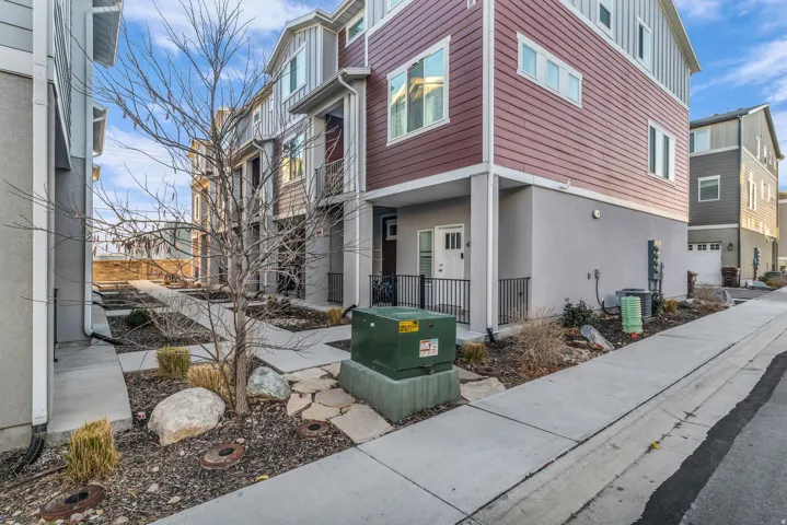 Multi-level facade featuring horizontal siding and stucco finishes