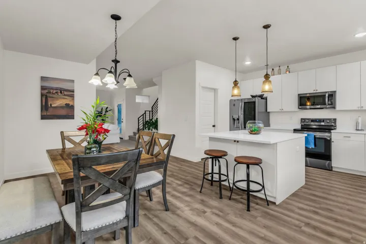 Open-concept living space with wood-finish flooring