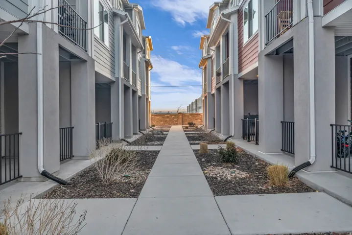 Modern townhome exteriors featuring horizontal siding and stucco finishes