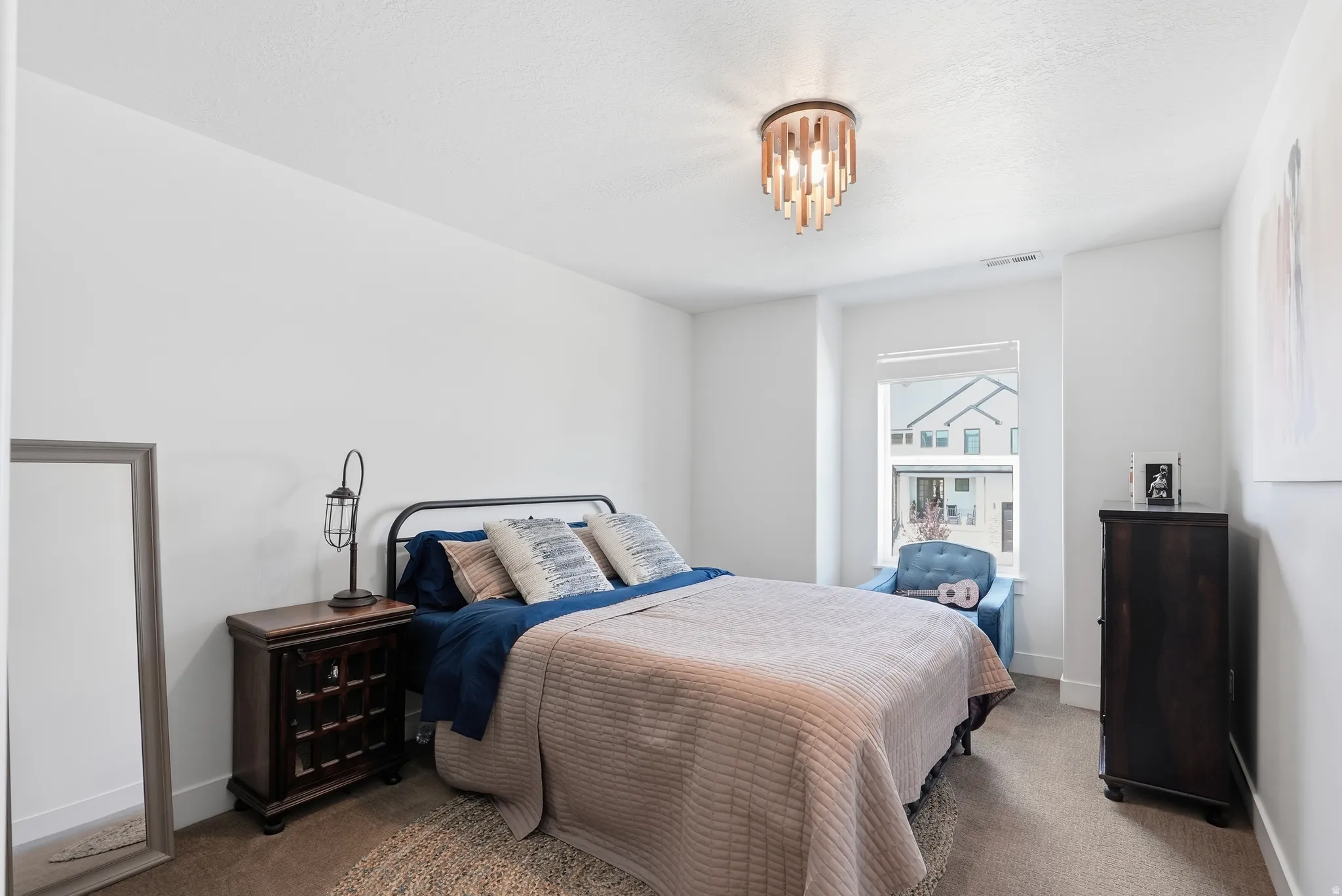 White walls, recessed window, and a contemporary ceiling fixture