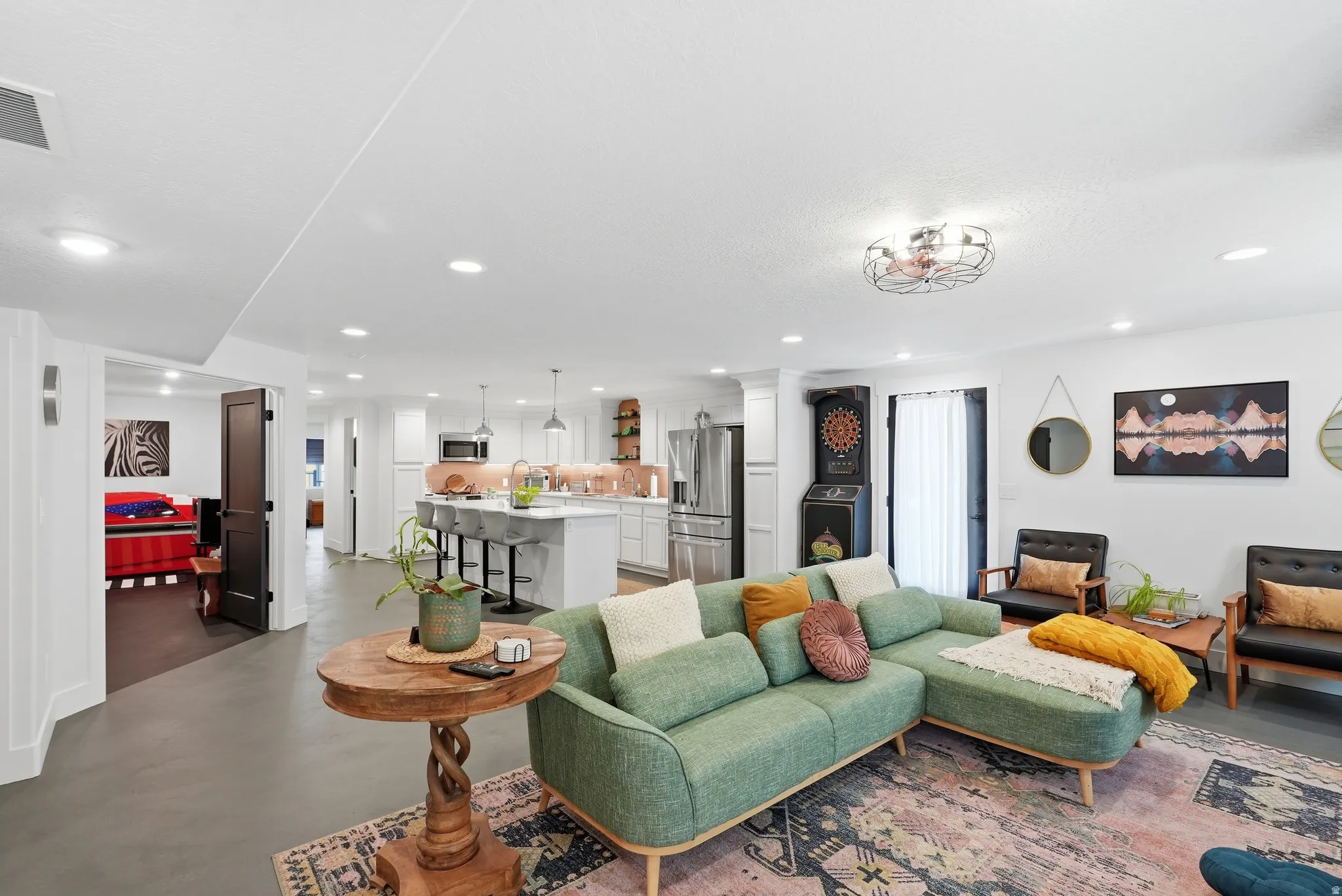 Open-concept living area featuring recessed lighting and a ceiling-mounted fixture
