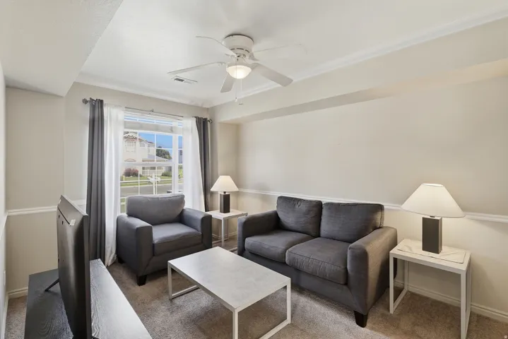 Recessed lighting, window with white trim, ceiling fan, crown molding, and wall molding
