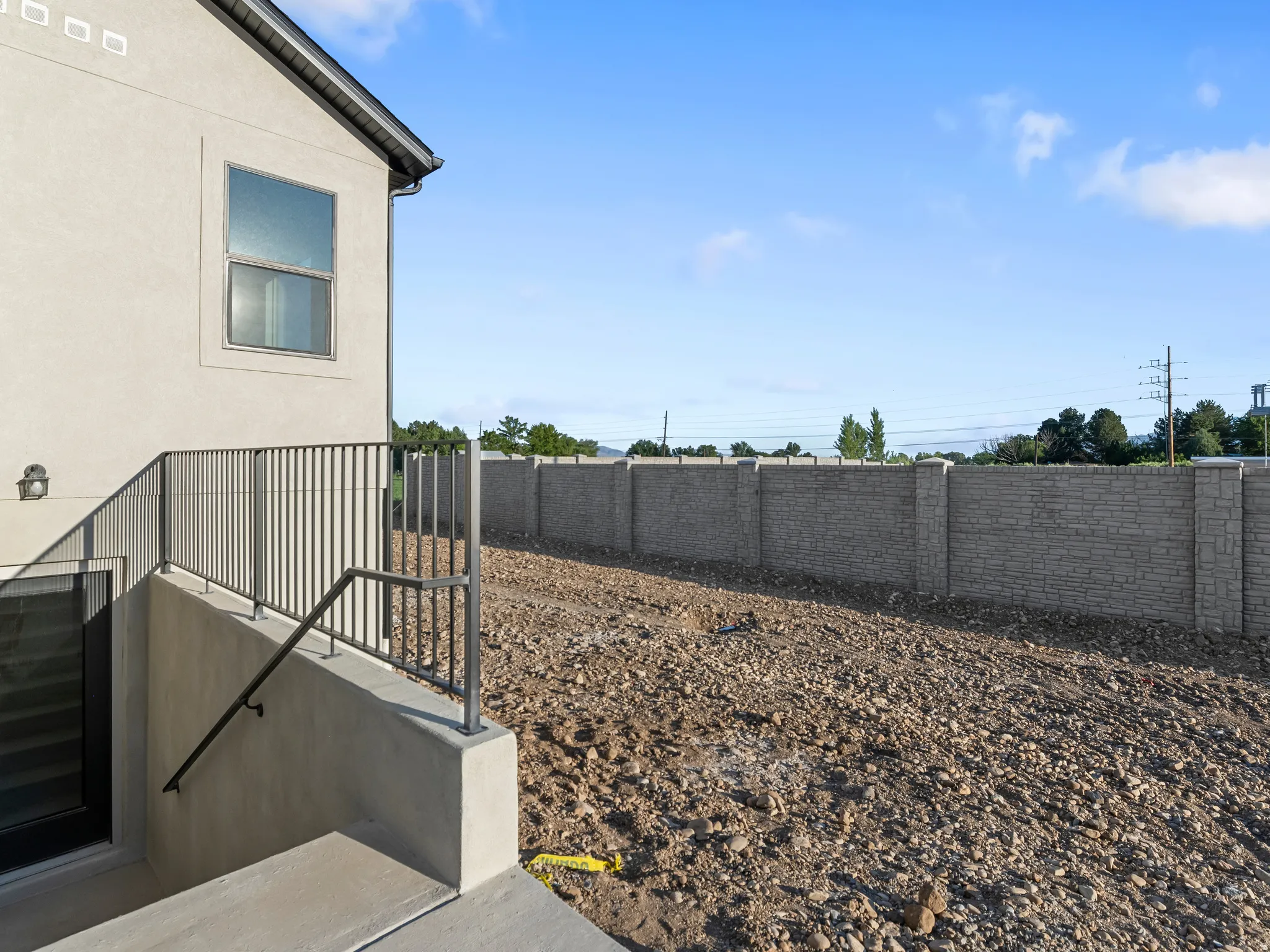 Stucco exterior with a single window