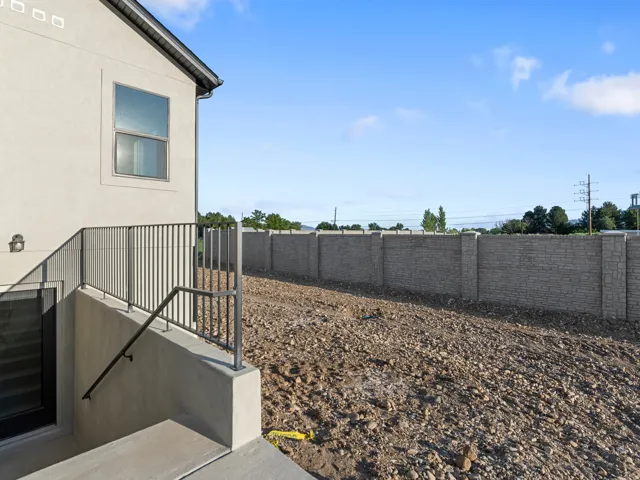 Stucco exterior with a single window