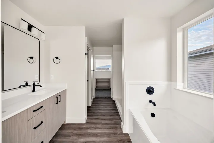 Dual-sink vanity with matte black fixtures and hardware