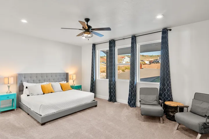 Spacious room featuring carpeting, recessed lighting, and a ceiling fan