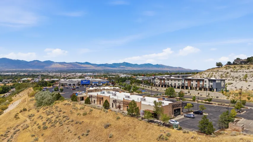 Expansive community featuring multi-story residential buildings and ground-floor commercial spaces