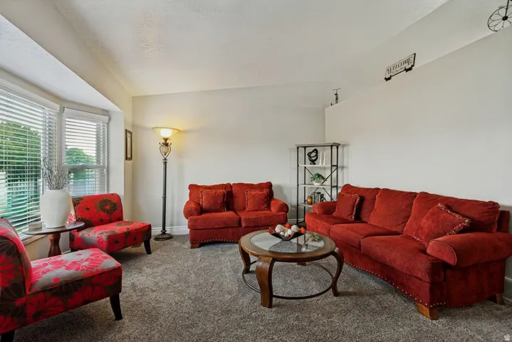 Living area with carpeting and light-toned walls