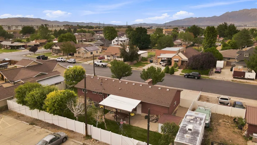 Aerial view showcasing a brick residence.