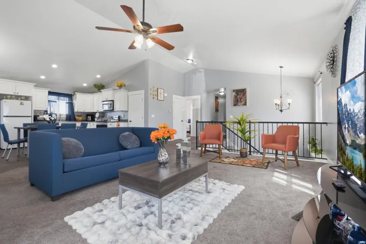Vaulted ceilings, recessed lighting, and an open-concept layout