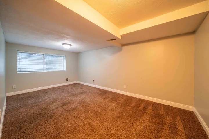Wall-to-wall carpeting and neutral wall tones