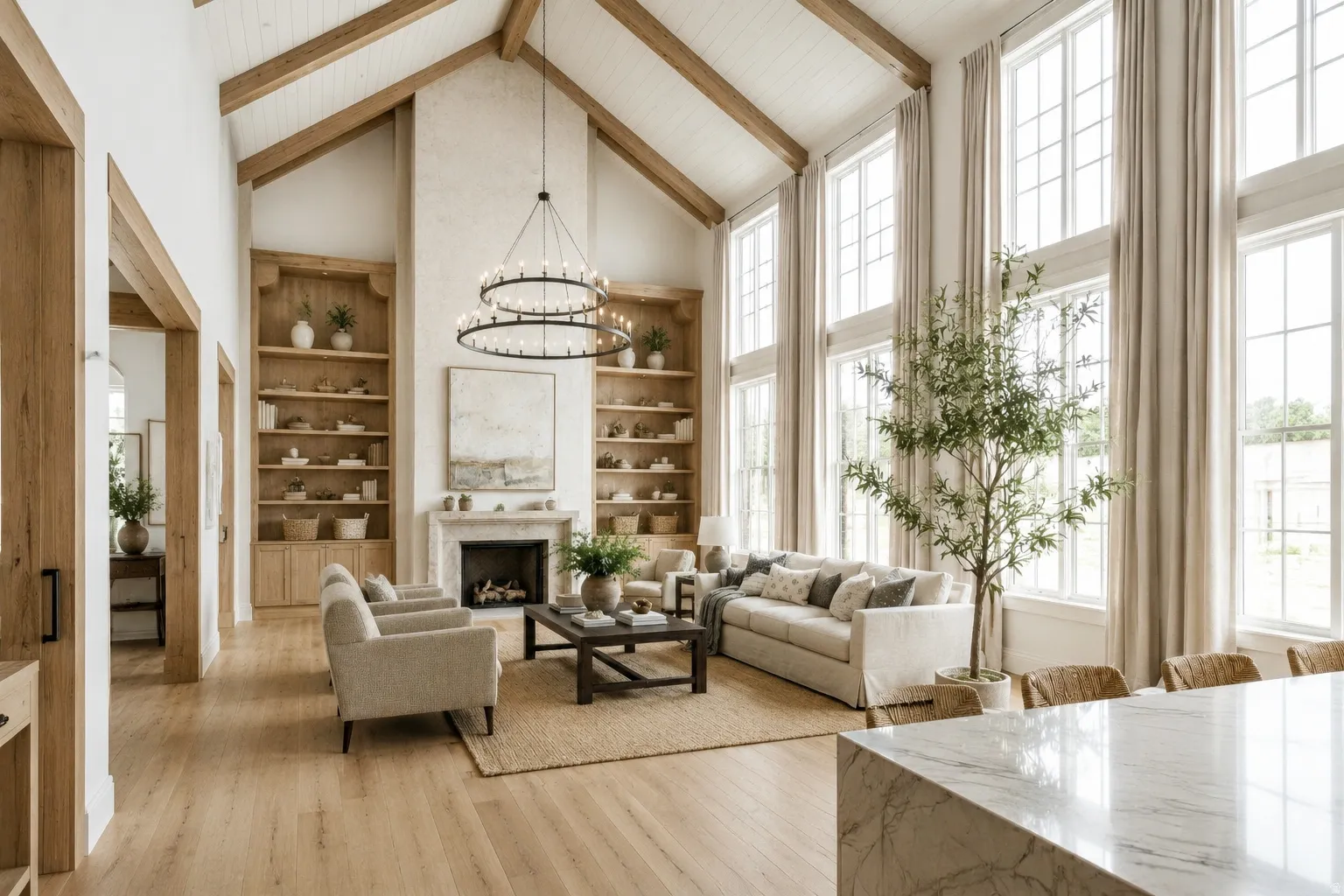 Vaulted ceilings with exposed wood beams, floor-to-ceiling windows, built-in shelving, stone fireplace with mantel, and wood-finish flooring