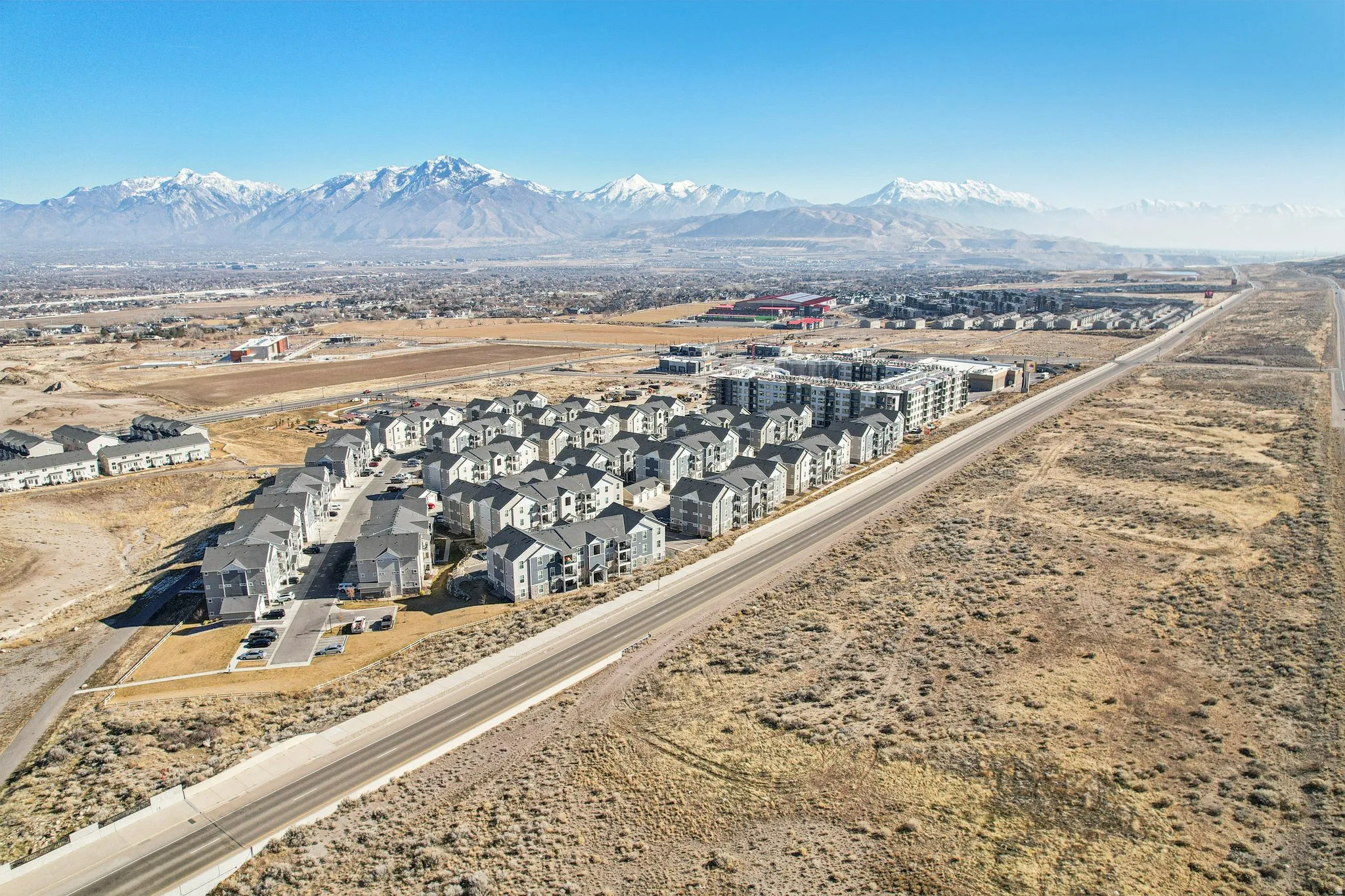 Expansive residential development with multiple buildings and paved roadways