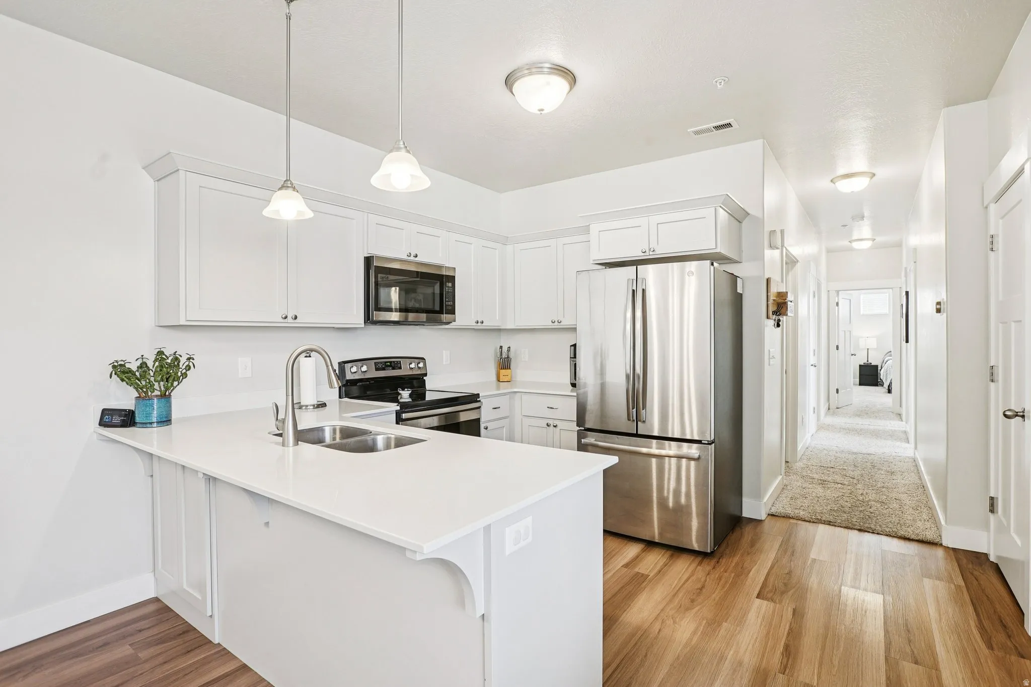 White cabinetry with brushed nickel hardware