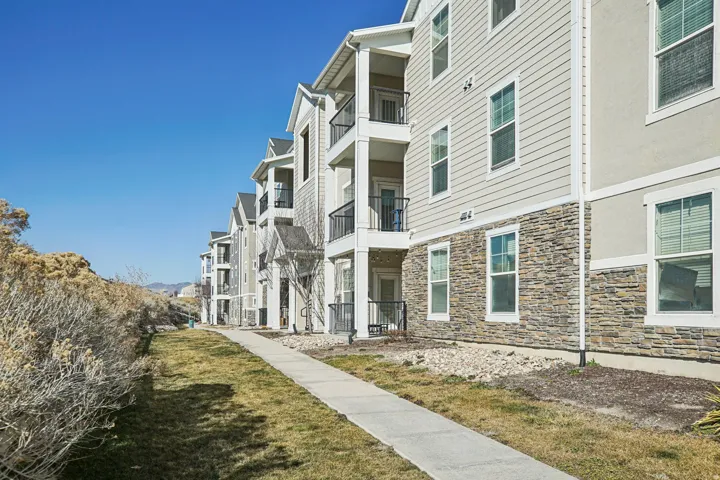 Multi-story building featuring stacked stone and horizontal siding