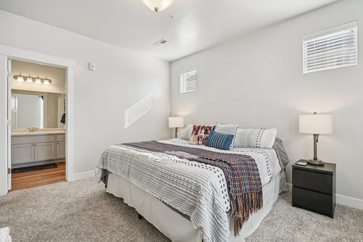 Neutral-toned walls with ceiling-mounted light fixture
