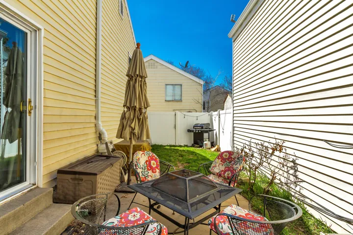 Patio area featuring a fire pit, concrete pavers, and direct exterior access