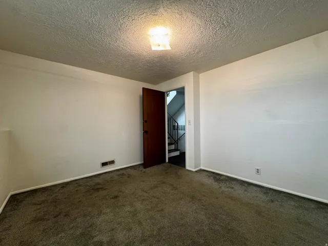 White painted walls with textured ceiling