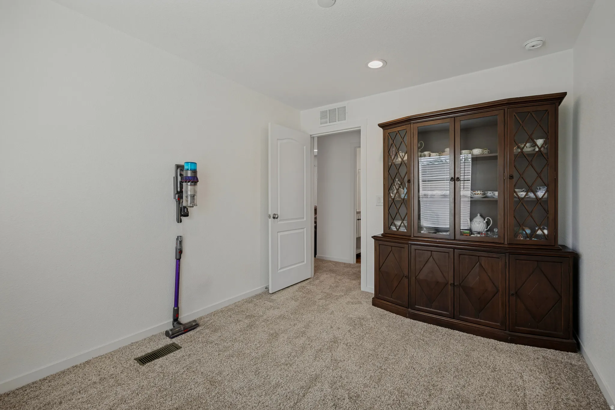 Recessed lighting and neutral wall paint